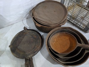 lot 108 image: Cast Iron Pot, Waffle Maker, and Four Pans