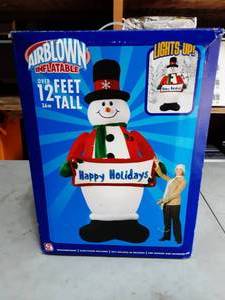 lot 9 image: 12 Ft. Lighted Inflatable Snow Man