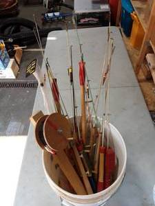 lot 14 image: Bucket Full Of Ice Fishing Jig Sticks & Rattle Reel