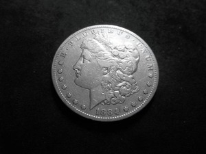 lot 12 image: 1884 S Morgan Silver Dollar