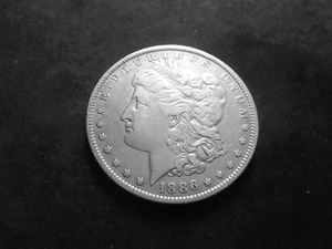 lot 17 image: 1886 O Morgan Silver Dollar