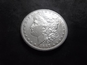 lot 19 image: 1887 S Morgan Silver Dollar