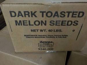 lot 267 image: 40 lb. Box Dark Toasted Melon Seeds...