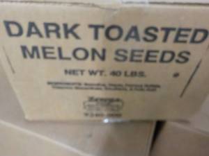 lot 268 image: 40 lb. Box Dark Toasted Melon Seeds...