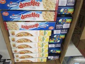 lot 36 image: Honey Oat Crunch Cereal, Hostess Do...
