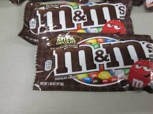lot 111 image: 12- 1.6 oz pks M&Ms...