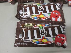 lot 112 image: 12- 1.6 oz pks M&Ms...