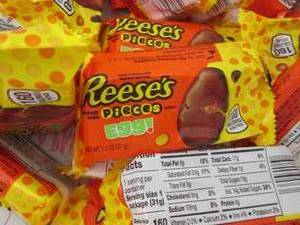 lot 168 image: 24 pks Reeses Pieces Eggs...
