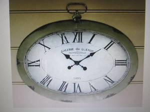 lot 335 image: Oval Wall Clock open box Retail $12...