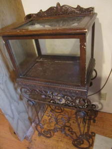 Showcase on ornate metal stand, sho...