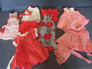 Doll clothes, nine with roller skat...