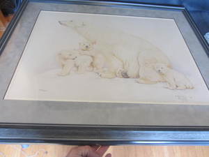 Polar bear family with three cubs p...