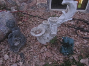Cement water feature, metal sculptu...