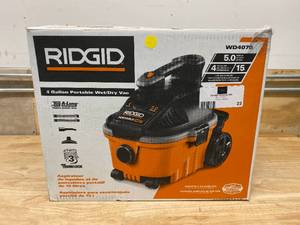 lot 23 image: RIGID 4 Gal. 5.0-Peak HP Portable WetDry Shop Vacuum with Filter, Hose and Accessories