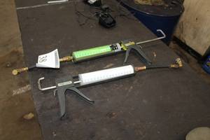 lot 38 image: Lot of (2) Spotgun AC Oil PAG Oil 100 Visc 8oz. With Gun, Universal AC Dye with eBoost 8oz. With Gun