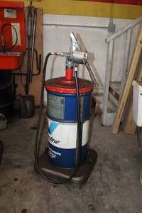 lot 63 image: Transmission Fluid Pump, Valvoline DexronMercon Automatic Transmission Fluid Can