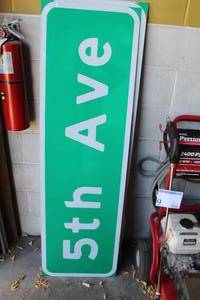 lot 139 image: Lot of (2) 5th Ave. Street Signs
