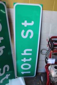 lot 140 image: Lot of (2) 10th St Street Signs
