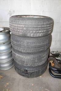 lot 128 image: Lot of (4) Mercedes-Benz 16 5-Lug Wheels and Goodyear All-Season 22555R16 95V Tires