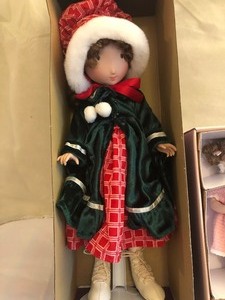 lot 54 image: Marie Osmond Holiday Doll  and Doll by Paulinette