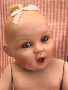 lot 107 image: Titus Toucher Porcelain Baby and Wall Hanging