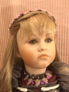 lot 128 image: Mundia Fully Jointed Porcelain Doll with Costume and Headpiece