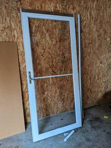 lot 573 image: Glass Storm Door 36 x 80