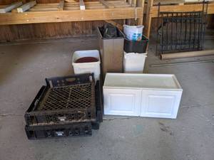 lot 600 image: White 2-Door Cabinet, Trash Cans, and More