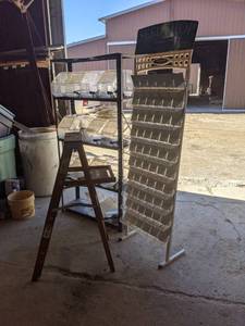 lot 618 image: Metal Shelf with Brachs Candy Plastic Bulk Bins, Seed Display Rack, and 4 Step Ladder