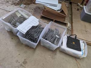 lot 644 image: (4) Totes of Assorted Peg Hooks & Promotional Banners etc.
