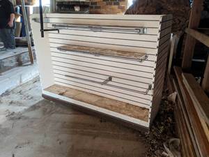 lot 670 image: Double Sided Rolling Slat Wall Shelf