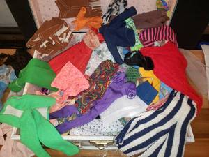 lot 59 image: Doll Case Full of Unmarked Barbie Size Clothing
