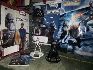 lot 28 image: Darth Vader & Clone Wars Alarm Clocks Plus Posters