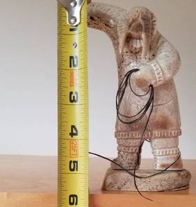 lot 201 image: Alaskan Carved Whale Bone Walrus Mask Spear Fisherman, Signed