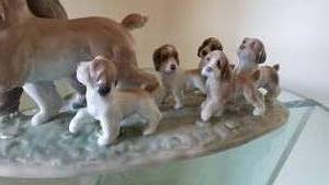 lot 133 image: Lladro Figurine  My Little Explorers Boy with Dogs 6828
