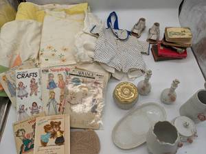 lot 42 image: Assorted Vintage Sewing Patterns, Kids Clothing, and Glassware