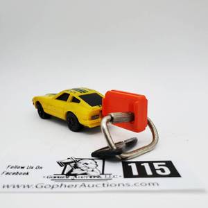 lot 115 image: Vintage 1980 Kidco Yellow Datsun Nissan 280 ZX Burnin Key Car 164 w Launch Key