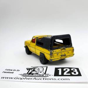 lot 123 image: 1973 Matchbox Rolamatics No. 57 Yellow Ford F-150 Wild Life Truck