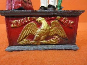 lot 21 image: Vintage Uncle Sam Cast Iron Coin Bank