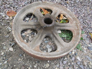 lot 63 image: (3) Cast Wheels & Auger Bit