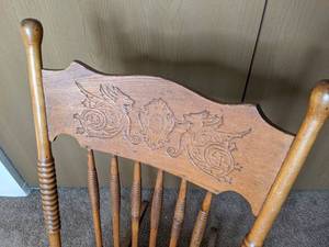 lot 114 image: Vintage Pressed Back Wood Rocking Chair with Griffin Design