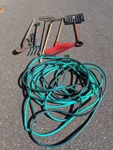 lot 213 image: Assorted Yard Tools Garden Hose, Rakes and Shovels