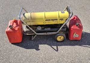 lot 214 image: John Deere Kerosene Portable Heater and Two Gas Cans
