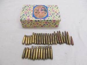lot 26 image: Vintage chocolate tin, ammo