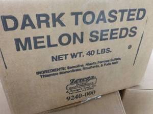 lot 230 image: 40 lb. Box Dark Roasted Melon Seeds...