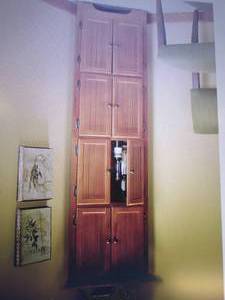 lot 10 image: 8-Door Corner Cabinet open box Reta...