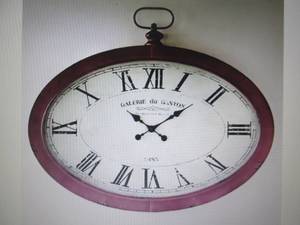 lot 43 image: Oval Wall Clock open box Retail $12...