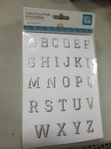 lot 100 image: Stack of Letter Sticker Packs...