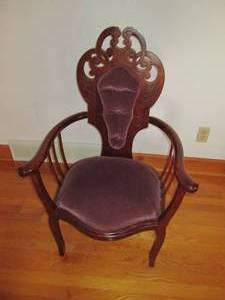 lot 6 image: Ornate wood chair with plush uphols...