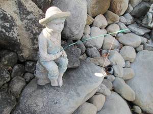 lot 101 image: Fishing boy figure...